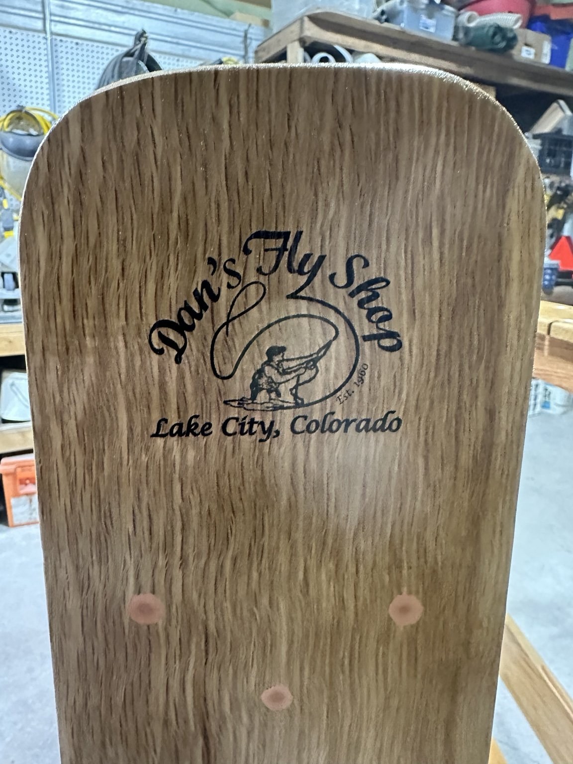 Dan's Fly Shop logo engraved on a net blade